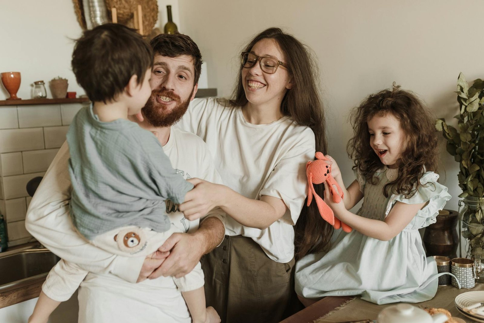 A joyful family enjoying time together in a warm, homely environment, capturing moments of happiness and togetherness.