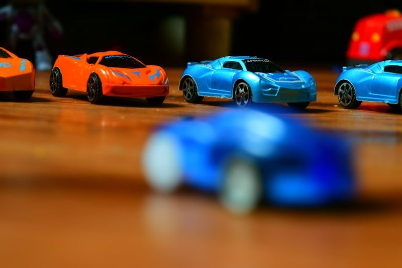 orange and blue ferrari coupe scale model