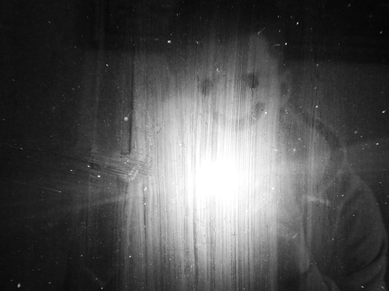 a black and white photo of a person's face