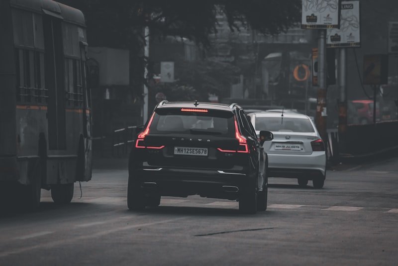 black hatchback on road