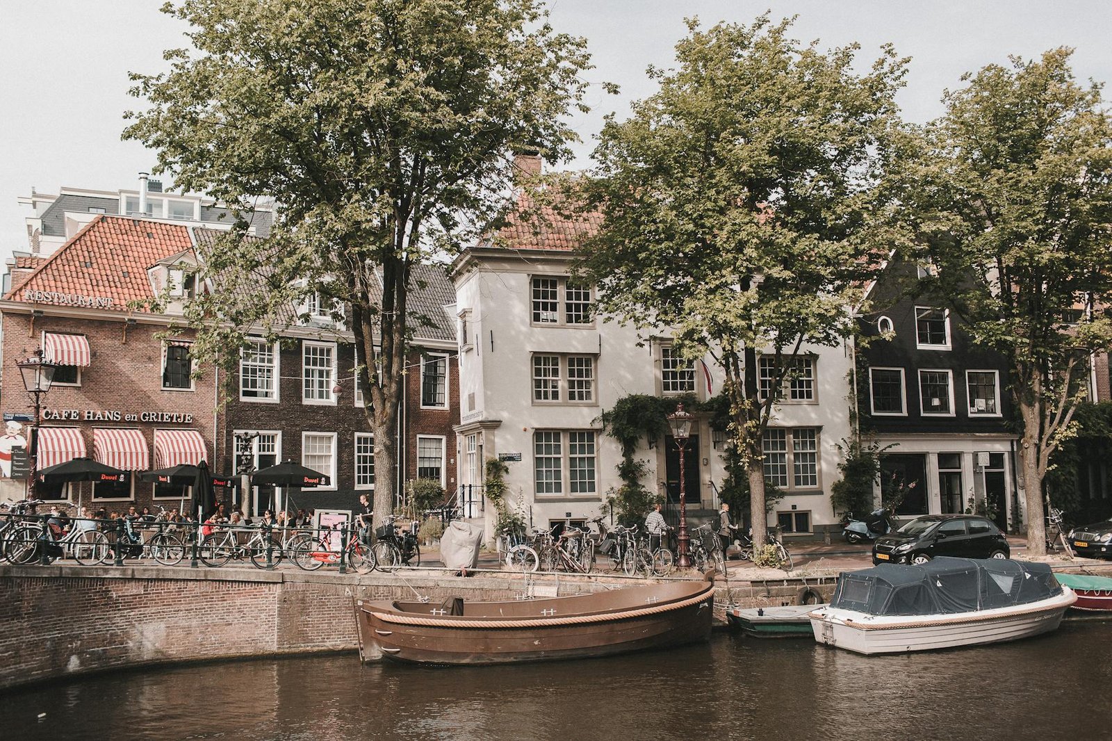 Explore the enchanting canals of Amsterdam with iconic bicycles and charming buildings.
