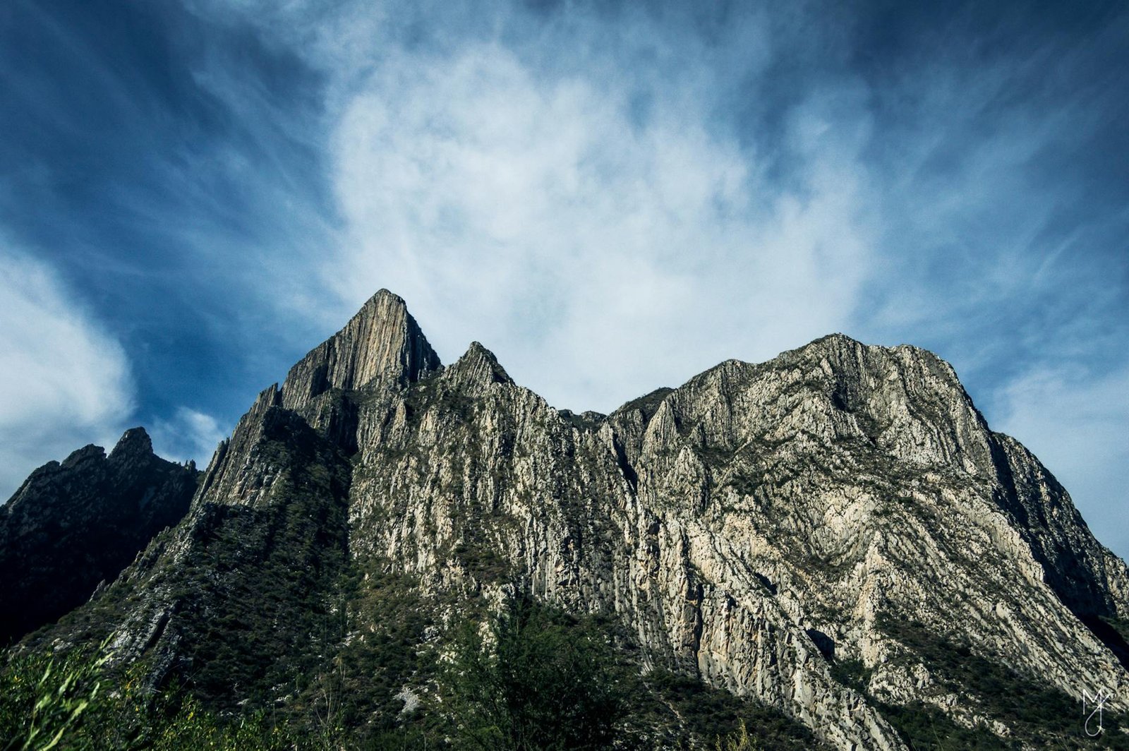 Majestic view of Monterrey's rocky mountain peaks against a blue sky. Perfect for adventure and nature themes.