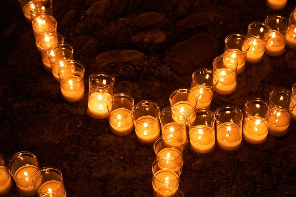 Candles arranged outdoors at night in Pedraza, creating a warm, glowing ambiance.