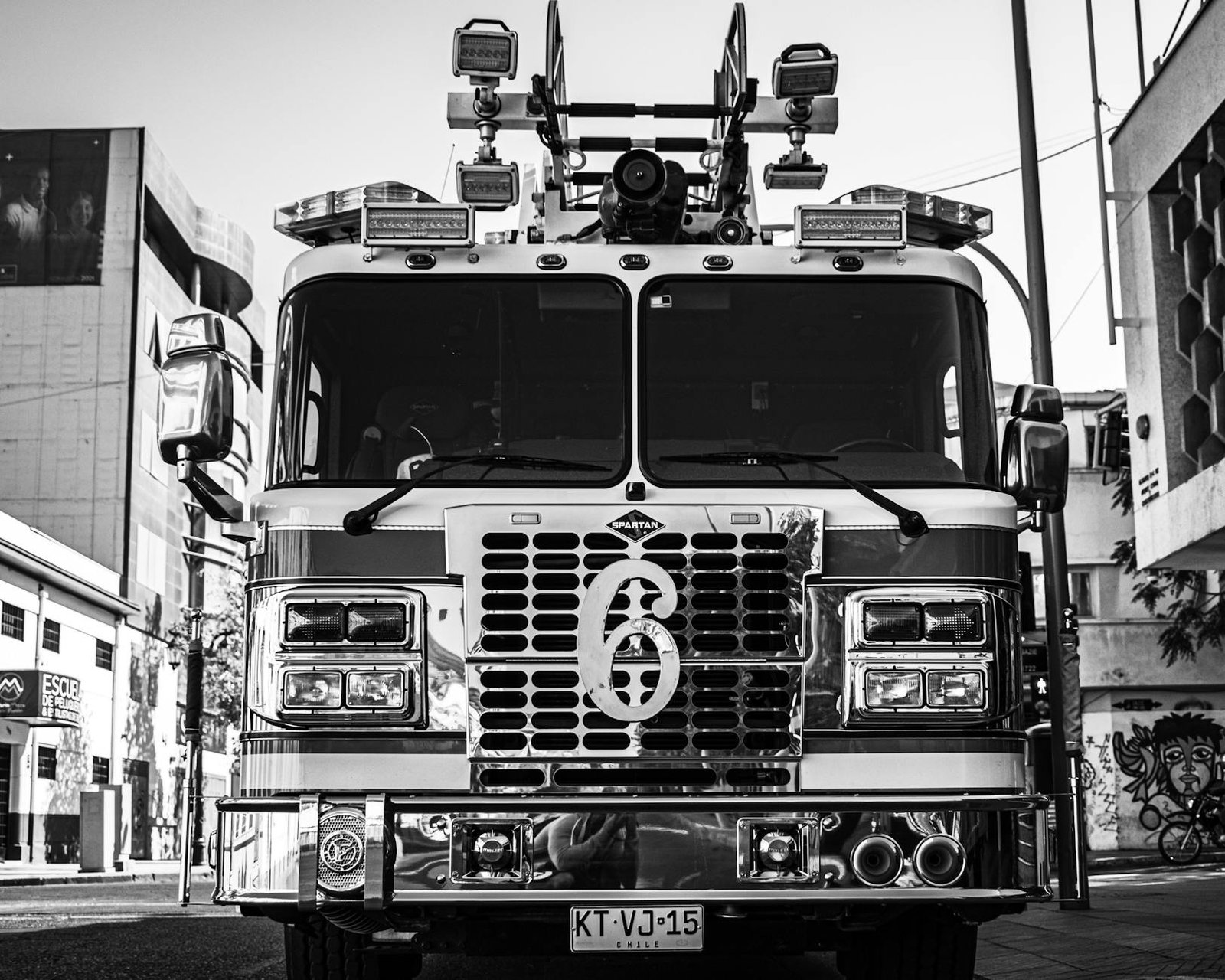 Black and white image of a parked fire truck on a street in Santiago, Chile.